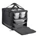 A black Vesture thermal chafer pan carrier bag with silver foil containers inside.