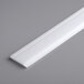 a white plastic strip on a gray surface