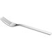A close-up of a WMF by BauscherHepp stainless steel cake fork with a silver handle.