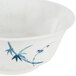 A white melamine bowl with a blue bamboo design.