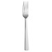 A close-up of a Hepp by Bauscher stainless steel table fork with a white handle.