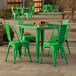 A Lancaster Table & Seating jade green table with green chairs on an outdoor patio.