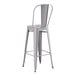 A Lancaster Table & Seating nickel gray metal barstool with a backrest.