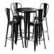 A Lancaster Table & Seating Onyx Black Bar Height Outdoor Table with 4 black cafe chairs.