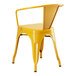 A yellow metal chair with arms and a backrest.