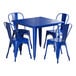 A blue rectangular Lancaster Table & Seating outdoor table with blue metal chairs.