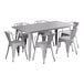 A Lancaster Table & Seating nickel gray table with six chairs.