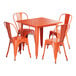 A Lancaster Table & Seating outdoor table in amber orange metal with four matching chairs.