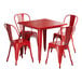 A Lancaster Table & Seating red metal table with four red chairs.