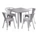 A Lancaster Table & Seating nickel gray square outdoor table with 4 chairs.