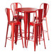 A Lancaster Table & Seating ruby red table with four barstools.