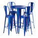 A blue Lancaster Table & Seating bar height table with four blue chairs.