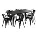 A Lancaster Table & Seating black rectangular table with chairs.