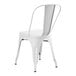A white metal chair with legs and a backrest.