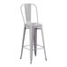 A gray metal bar height chair with a backrest.
