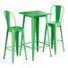 A Lancaster Table & Seating jade green table with two green barstools.