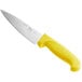 A Choice chef knife with a yellow handle.