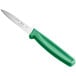 A Choice paring knife with a green handle.