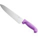 a large knife with a purple handle