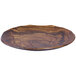 An Elite Global Solutions Sequoia wood grain melamine plate with a wavy edge on a table.