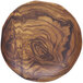 a round wooden plate with a pattern