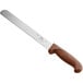 a knife with a brown handle