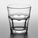 A close up of a Pasabahce Casablanca clear glass with a curved rim.