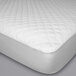 A white Protect-A-Bed mattress protector with a quilted surface.