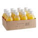 A cardboard box full of Boylan Bottling Co. Mash Ripe Mango Blood Orange sparkling fruit beverage bottles.