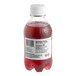 A Boylan Bottling Co. Mash Pomegranate Blueberry sparkling fruit beverage bottle with a red label filled with red liquid.