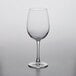 A Nude Reserva wine glass on a table.