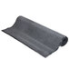 A roll of black carpet on a white background.