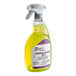 A bottle of Noble Chemical Lemon Lance on a table in a professional kitchen.