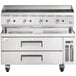 A large stainless steel Cooking Performance Group gas countertop charbroiler over two refrigerated drawers.