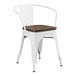 A white Lancaster Table & Seating metal arm chair with a walnut wood seat.