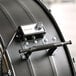 A close up of a black drum fan with a black and white speed regulator.