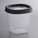A Ball clear plastic freezer jar with a black lid.