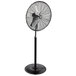 A large black TPI industrial pedestal fan.