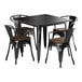 A Lancaster Table & Seating black metal table with four chairs with walnut seats.
