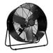 A black TPI industrial mini drum fan on a stand.