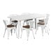 A Lancaster Table & Seating white table with walnut wood chairs.