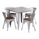 A Lancaster Table & Seating Alloy Series nickel gray table with walnut wood seats and four chairs.