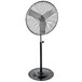 A large black TPI industrial pedestal fan on a stand.