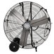 A large black TPI industrial drum fan with wheels.