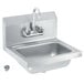 A Vollrath stainless steel wall mounted hand sink with faucet and strainer.