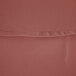 A close-up of a mauve polyester cloth with a hemmed edge.