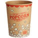 A brown and red Carnival King paper cup with popcorn on it.