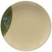 A white plate with a green swirl design.