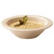 A close up of a GET BamboMel rimmed bowl with soup in it.