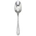 A close-up of a Oneida Ivy Flourish stainless steel teaspoon with a pattern on the handle.